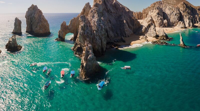 Downward Looking Aerial of the shallow water in Cabo San Lucas, Baja California Sur, Mexico near the Darwin Arch glass bottom boats viewing sealife