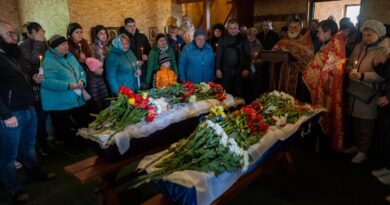 Relatives bury children killed in Russian missile attack