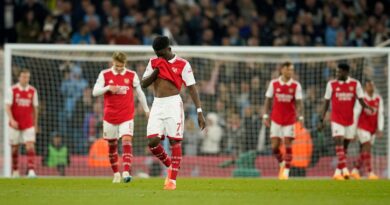 Arsenal's Bukayo Saka, center, reacts after Manchester City's scored their third goal during the English Premier League soccer match between Manchester City and Arsenal at Etihad stadium in Manchester, England, Wednesday, April 26, 2023. (AP Photo/Dave Thompson)