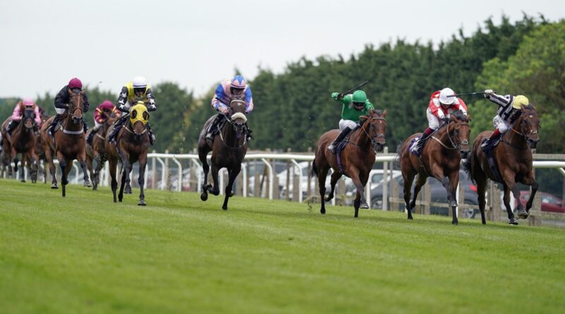 David Egan riding Toofi (right) win The Racing With Pride Handicap at Brighton Racecourse