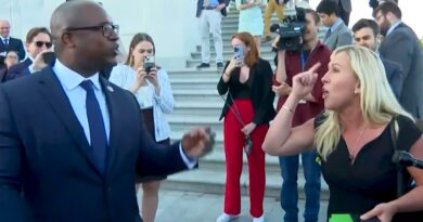 Jamaal Bowman and Marjorie Taylor Greene argue on the Capitol steps.