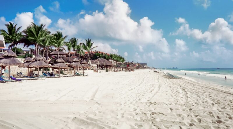 View Of Beach Against Cloudy Sky