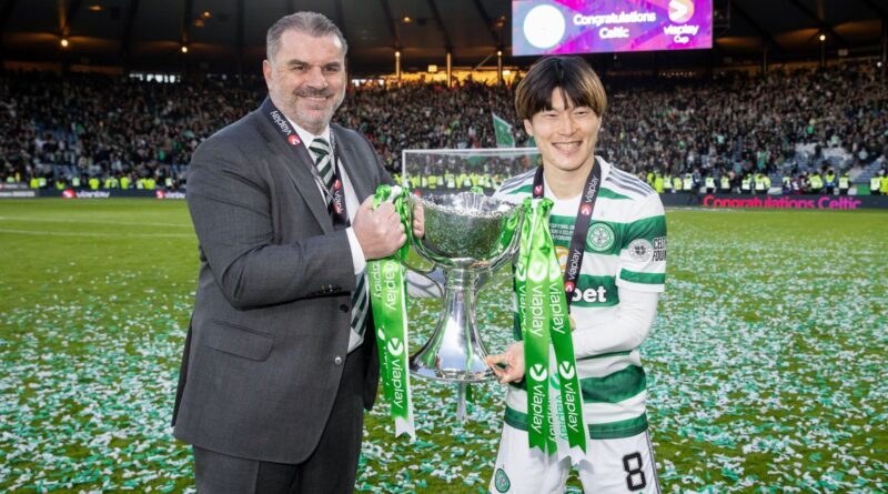 GLASGOW, SCOTLAND - FEBRUARY 26: Celtic manager Ange Postecoglou (L) and Kyogo Furuhashi with the trophy during the Viaplay Cup final between Rangers and Celtic at Hampden Park, on February 26, 2023, in Glasgow, Scotland.  (Photo by Alan Harvey / SNS Group)