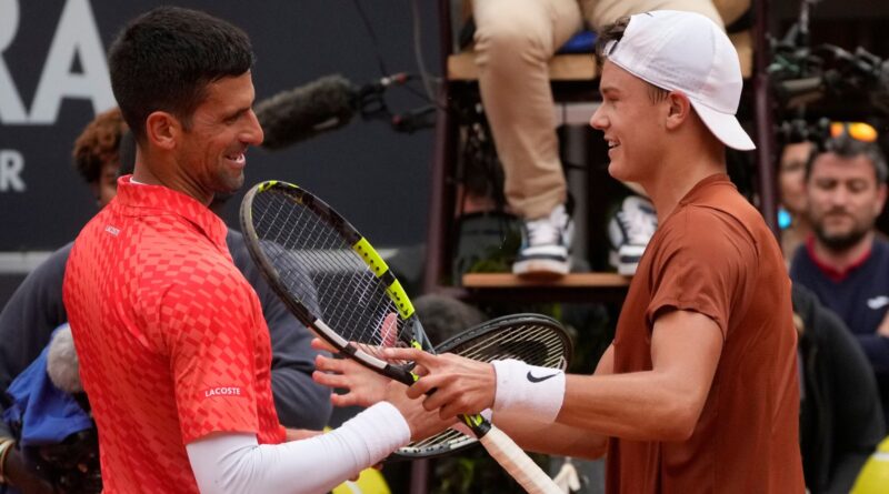 Denmark's Holger Rune, right, celebrates after winning the quarter final match against Serbia's Novak Djokovic at the Italian Open tennis tournament, in Rome, Wednesday, May 17, 2023. (AP Photo/Gregorio Borgia)