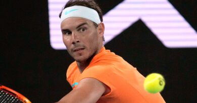 Rafael Nadal of Spain plays a backhand return to Mackenzie McDonald of the U.S. during their second round match at the Australian Open tennis championship in Melbourne, Australia, Wednesday, Jan. 18, 2023. (AP Photo/Dita Alangkara)