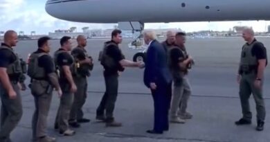 Trump is greeted by law enforcement as he arrives in Massachusetts.