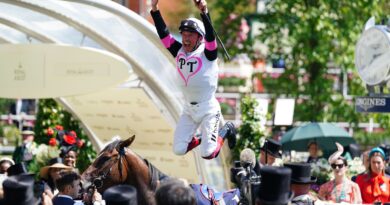 Frankie Dettori with a flying dismount after winning the Albany on Porta Fortuna