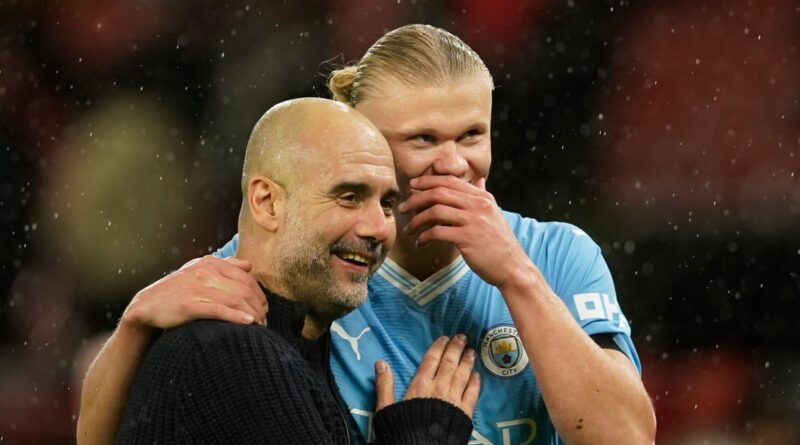 Manchester City's head coach Pep Guardiola talks to Manchester City's Erling Haaland after the English Premier League soccer match between Manchester United and Manchester City at Old Trafford stadium in Manchester, England, Sunday, Oct. 29, 2023. (AP Photo/Dave Thompson)