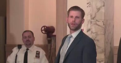 Eric Trump talks to the media after fraud trial testimony.