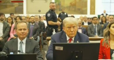 Trump sitting at the defense table during his New York fraud trial.