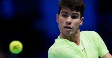 Spain's Carlos Alcaraz returns the ball to Germany's Alexander Zverev during their singles tennis match of the ATP World Tour Finals at the Pala Alpitour, in Turin, Italy, Monday, Nov. 13, 2023. (AP Photo/Antonio Calanni)