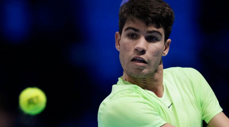 Spain's Carlos Alcaraz returns the ball to Germany's Alexander Zverev during their singles tennis match of the ATP World Tour Finals at the Pala Alpitour, in Turin, Italy, Monday, Nov. 13, 2023. (AP Photo/Antonio Calanni)