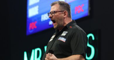 Grand Slam of Darts: Michael Smith title defence over after defeat to James Wade as Ryan Searle lands nine-darter