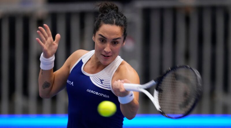 Italy's Martina Trevisan returns to Germany's Eva Lys during their group stage tennis match at the Billie Jean King Cup finals at La Cartuja stadium in Seville, southern Spain, Spain, Thursday, Nov. 9, 2023. (AP Photo/Manu Fernandez)