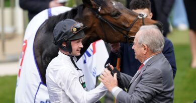 Jockey Nico de Boinville and owner Michael Buckley celebrate winning the Sky Bet Supreme Novices' Hurdle with Constitution Hill during day one of the 2022 Cheltenham Festival