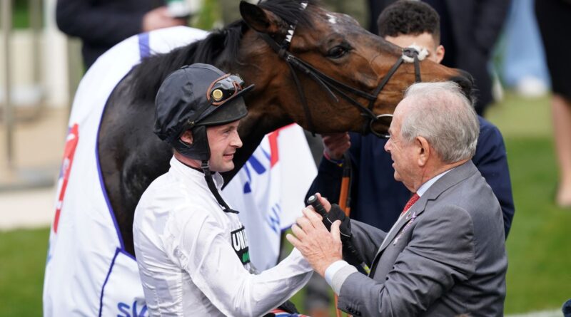 Jockey Nico de Boinville and owner Michael Buckley celebrate winning the Sky Bet Supreme Novices' Hurdle with Constitution Hill during day one of the 2022 Cheltenham Festival