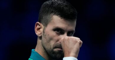 Serbia's Novak Djokovic reacts during the singles tennis match against Denmark's Holger Rune, of the ATP World Tour Finals at the Pala Alpitour, in Turin, Italy, Sunday, Nov. 12, 2023. (AP Photo/Antonio Calanni)