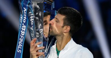 Serbia's Novak Djokovic poses with his trophy after defeating Norway's Casper Ruud 7-5, 6-3, in the singles final tennis match to win the ATP World Tour Finals at the Pala Alpitour, in Turin, Italy, Sunday, Nov. 20, 2022. (AP Photo/Antonio Calanni)