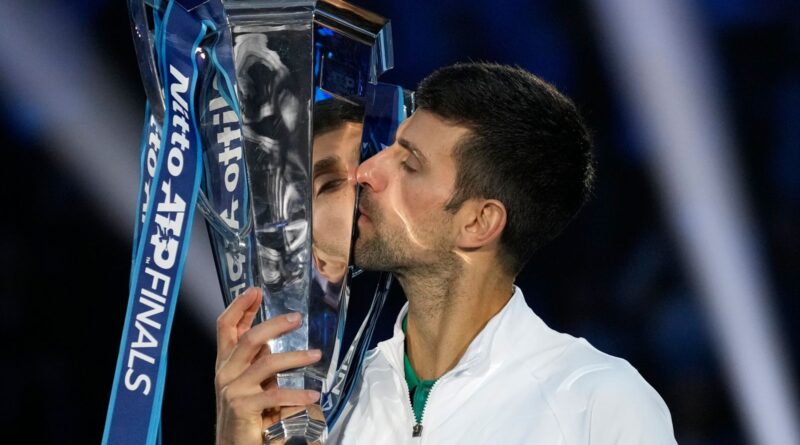 Serbia's Novak Djokovic poses with his trophy after defeating Norway's Casper Ruud 7-5, 6-3, in the singles final tennis match to win the ATP World Tour Finals at the Pala Alpitour, in Turin, Italy, Sunday, Nov. 20, 2022. (AP Photo/Antonio Calanni)