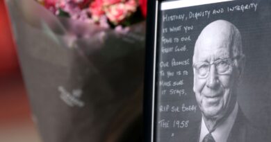 Tributes are laid in memory of Sir Bobby Charlton by The United Trinity statue at Old Trafford