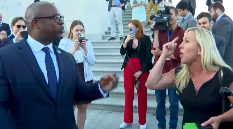 Jamaal Bowman and Marjorie Taylor Greene argue on the Capitol steps.