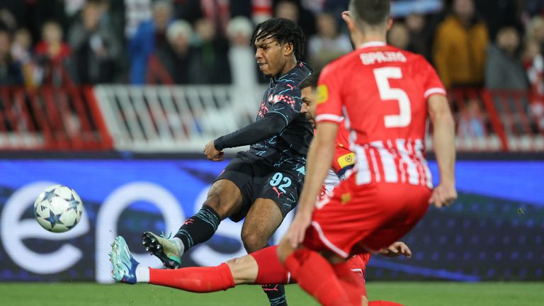 Manchester City's English midfielder #92 Micah Hamilton (L) scores his team's first goal during the UEFA Champions League Group G day 6 group stage football match between Crvena Zvezda (Red Star Belgrade) and Manchester City at the Red Star stadium in Belgrade, on December 13, 2023. (Photo by PEDJA MILOSAVLJEVIC / AFP)