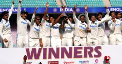 Indian women cricket team players pose with the trophy after wining the test match against England at the D Y Patil Stadium in Mumbai, India, Saturday, Dec. 16, 2023. (AP Photo/Rajanish Kakade)