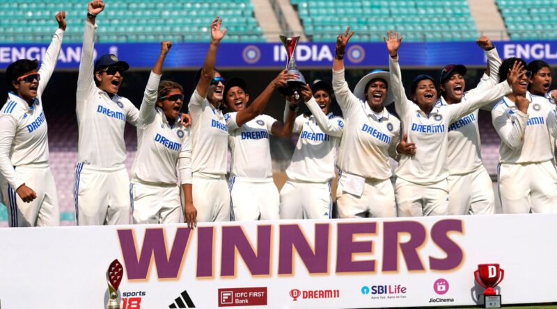 Indian women cricket team players pose with the trophy after wining the test match against England at the D Y Patil Stadium in Mumbai, India, Saturday, Dec. 16, 2023. (AP Photo/Rajanish Kakade)