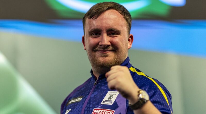 World Darts Championship: Luke Littler continues dream debut by beating Matt Campbell to reach last-16