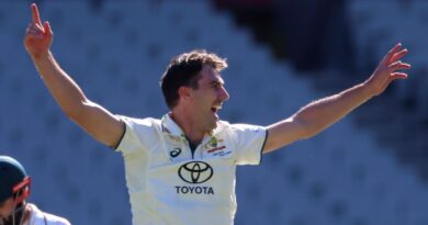 Australia's Pat Cummins, center, appeals for a LBW decision on Pakistan's Mohammad Rizwan, left, who will be out on review during the fourth day of their cricket test match in Melbourne, Friday, Dec. 29, 2023. (AP Photo/Asanka Brendon Ratnayake)