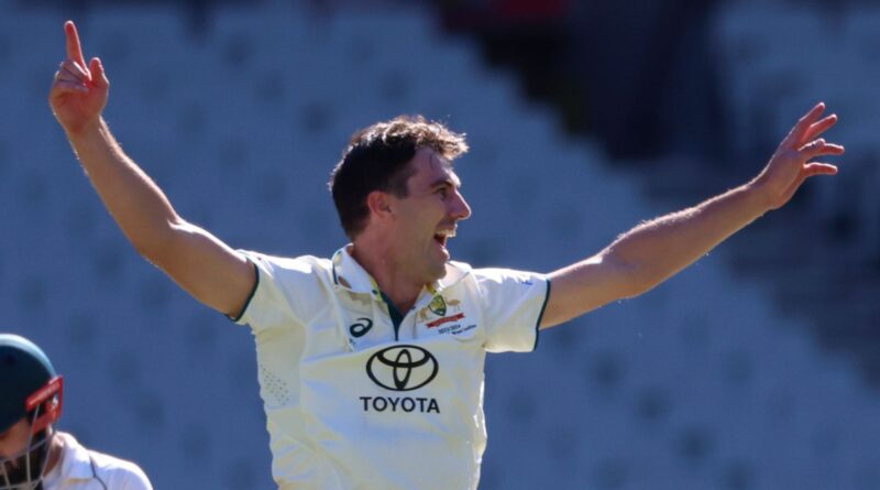 Australia's Pat Cummins, center, appeals for a LBW decision on Pakistan's Mohammad Rizwan, left, who will be out on review during the fourth day of their cricket test match in Melbourne, Friday, Dec. 29, 2023. (AP Photo/Asanka Brendon Ratnayake)