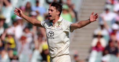 Australia's Pat Cummins celebrates after he dismissed Pakistan's Agha Salman for five