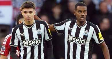 Goalscorer Alexander Isak celebrates with team-mate Lewis Miley