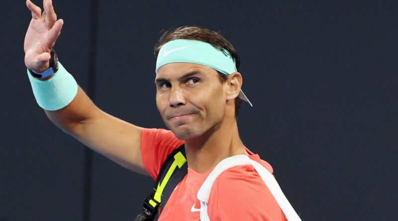 Rafael Nadal of Spain waves to the crowd in his doubles match against Australia's Max Purcell and Jordan Thompson during the Brisbane International tennis tournament in Brisbane, Australia, Sunday, Dec. 31, 2023. (AP Photo/Tertius Pickard)