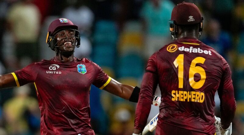 West Indies' Matthew Forde celebrates with Romario Shepherd after West Indies' win (Associated Press)