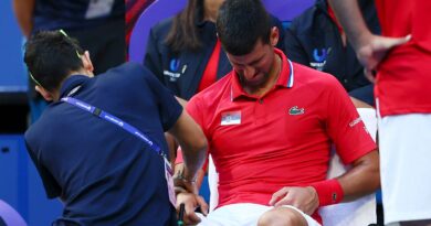 Novak Djokovic receives treatment on a wrist injury