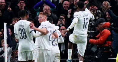 The Tottenham players celebrate Porro's winner