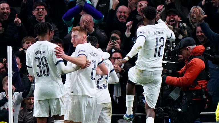 The Tottenham players celebrate Porro's winner